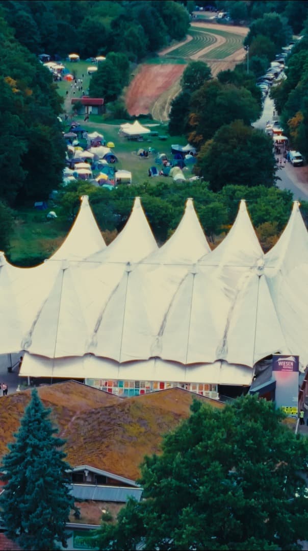 Festival camping area with tents and caravans